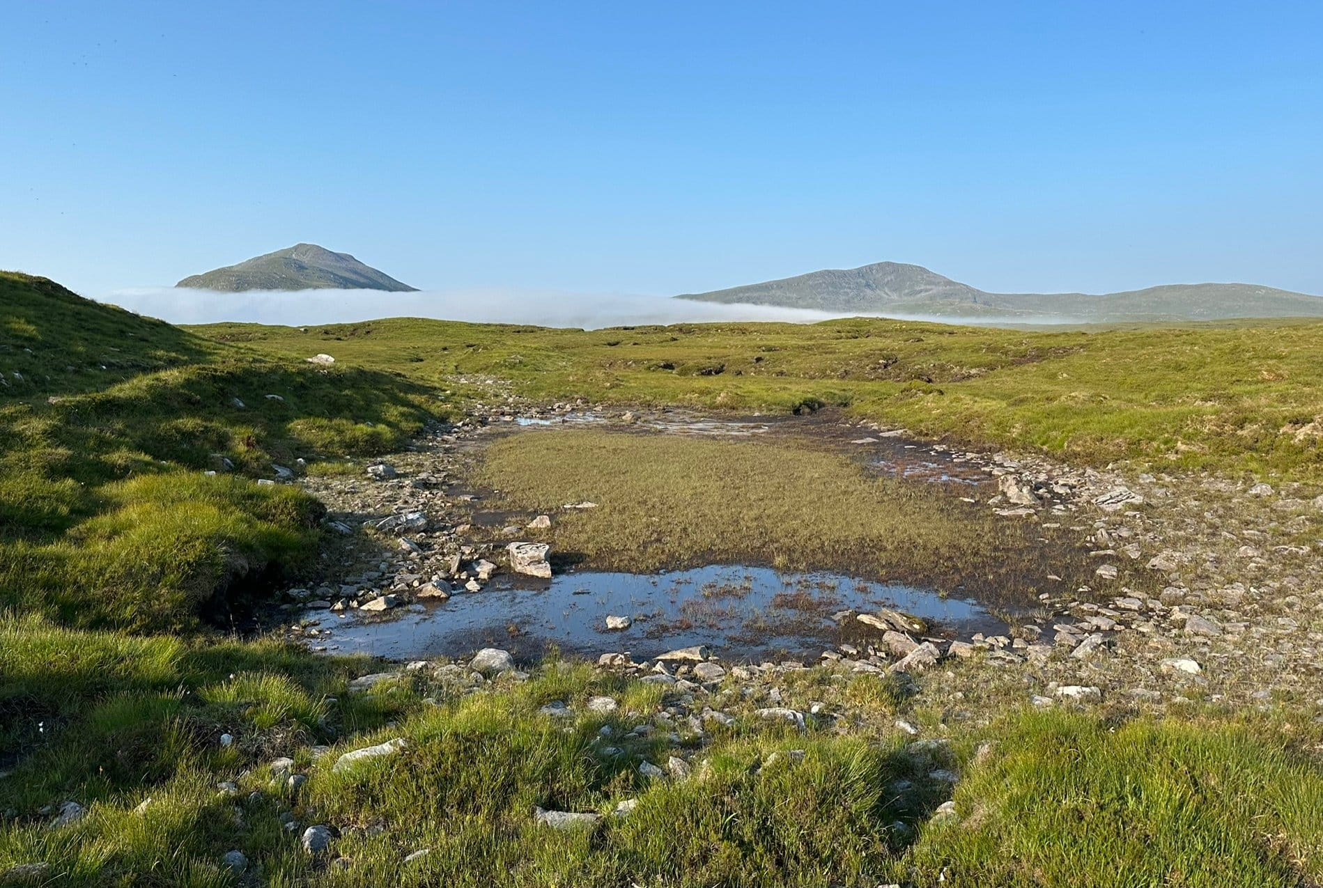 DISTANT TARGET: Beinn Leoid, right, and Meallan a' Chuail visible from the approach as they rise above the early morning mist