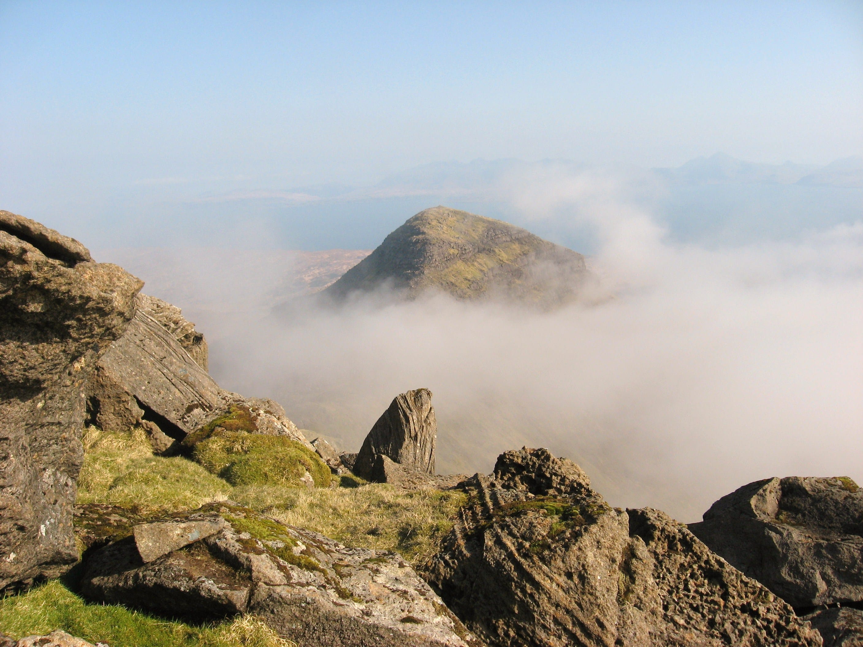 PEEK SHOW: Hallival's peak peeks out from a sea of wispy cloud in this view from the slopes of Askival