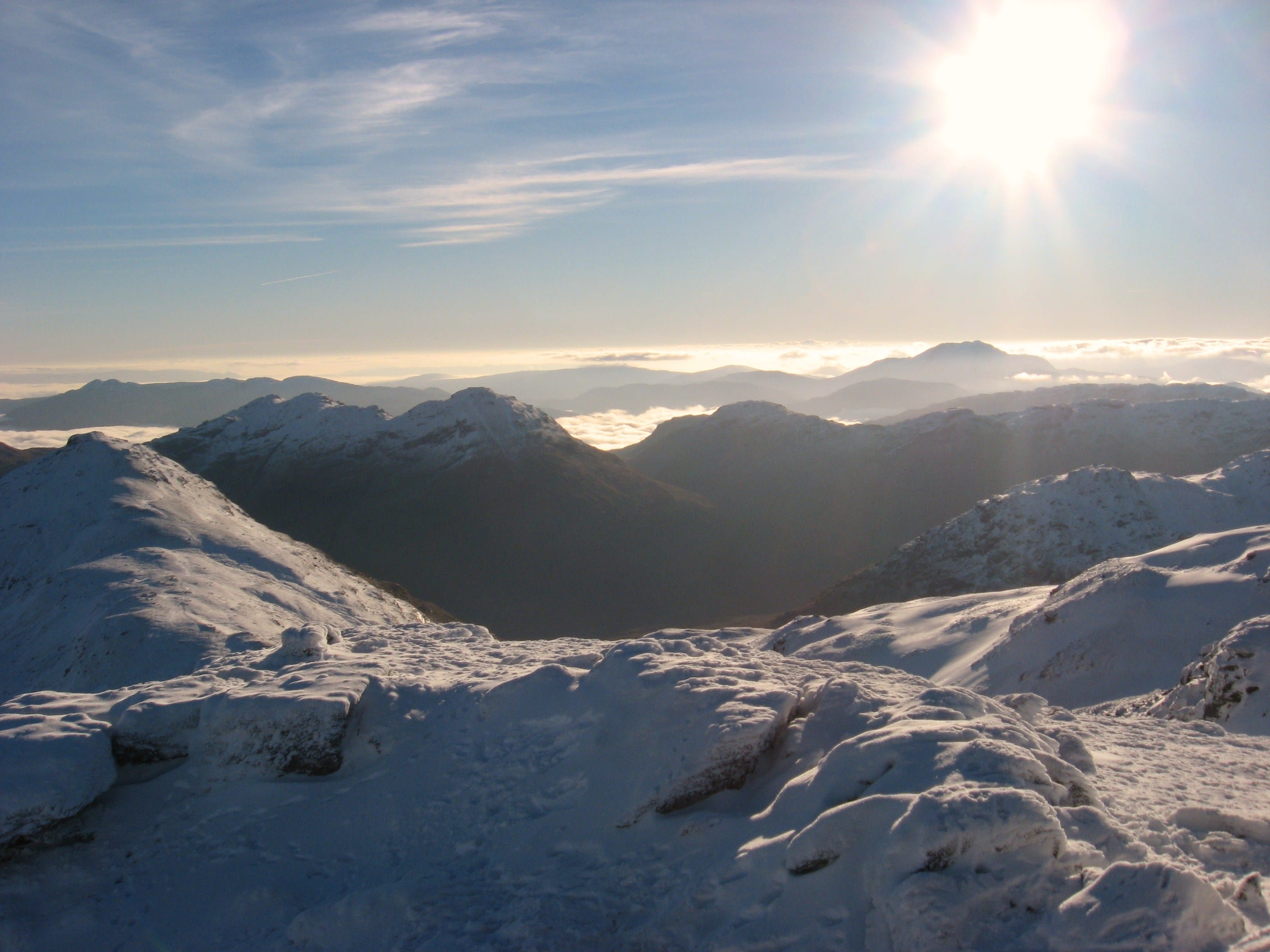 WHITE LIGHT: Brilliant sun on brilliant white peaks in the view from the summit of frozen Beinn Tulaichean