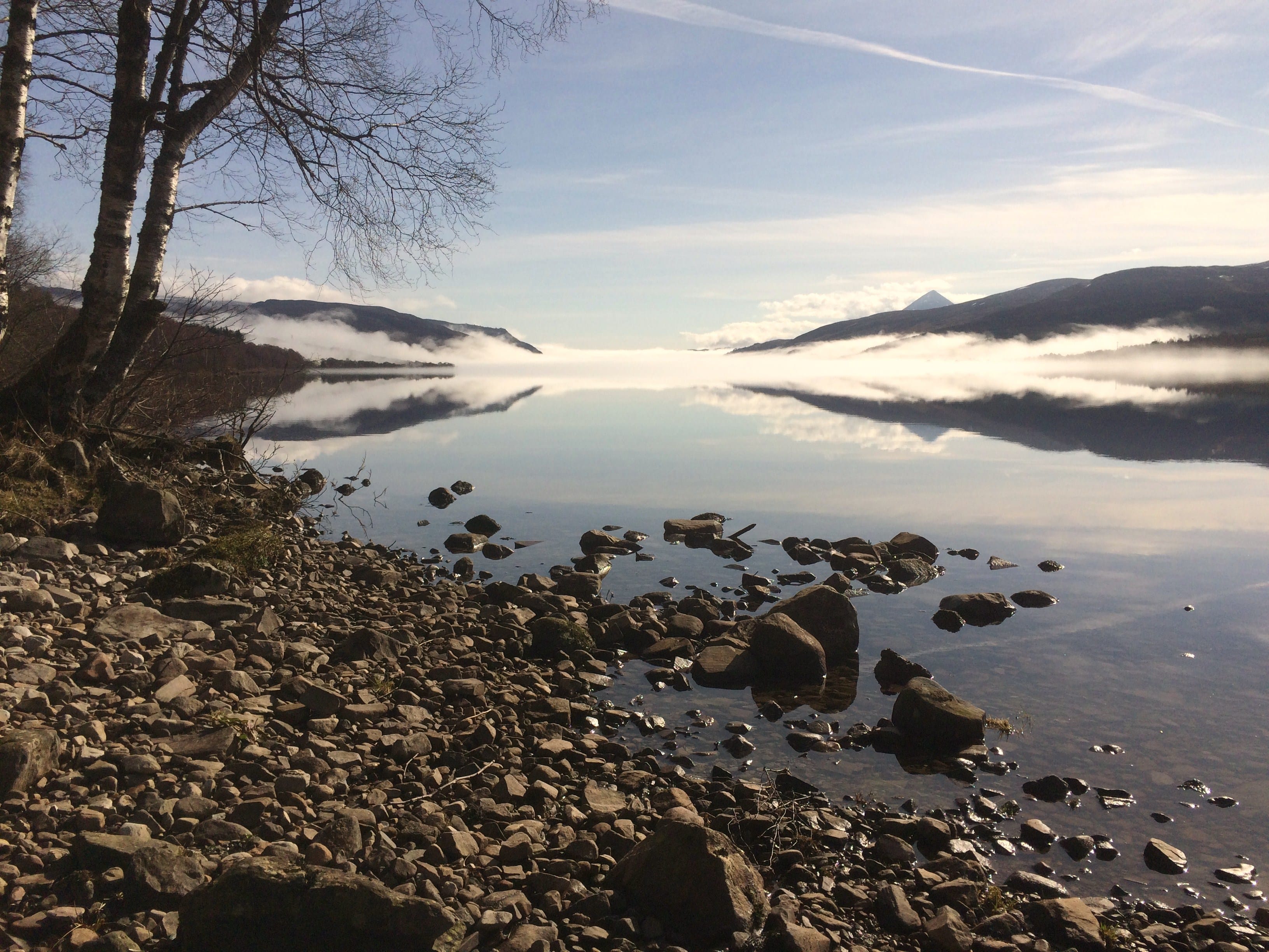 PERFECT PEACE: Loch Rannoch sparkles in the morning sunshine, reflecting the light band of cloud hanging just above its surface