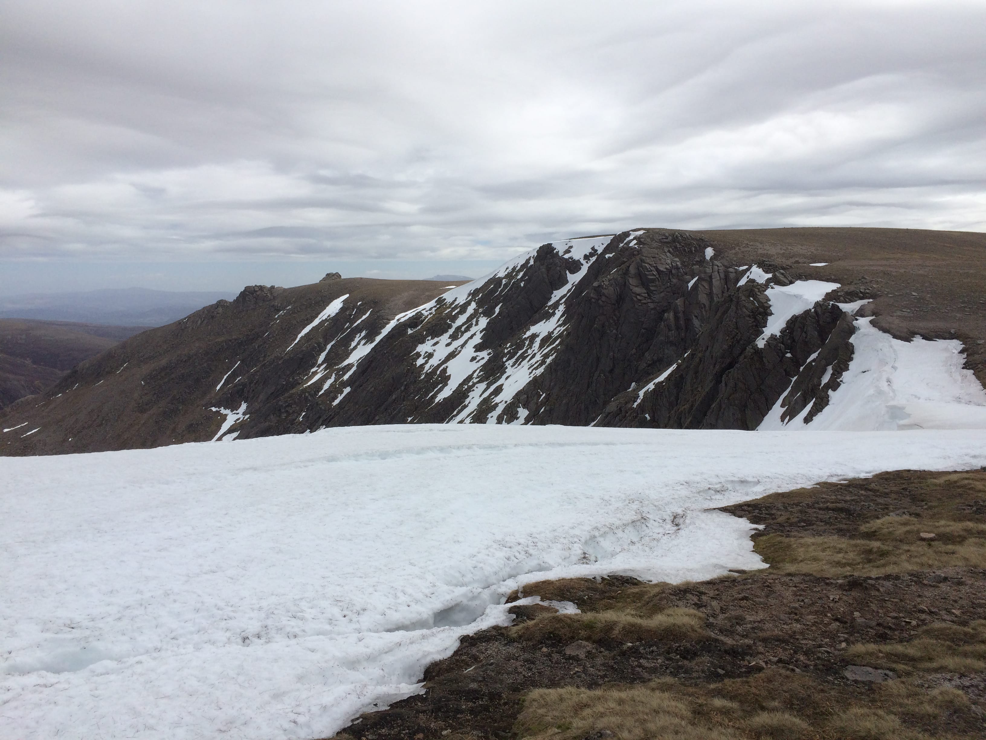 SAVAGE PLATEAU: The cliffs of Beinn a' Bhuird can hold cornices well into summer - but it's a fragile landscape