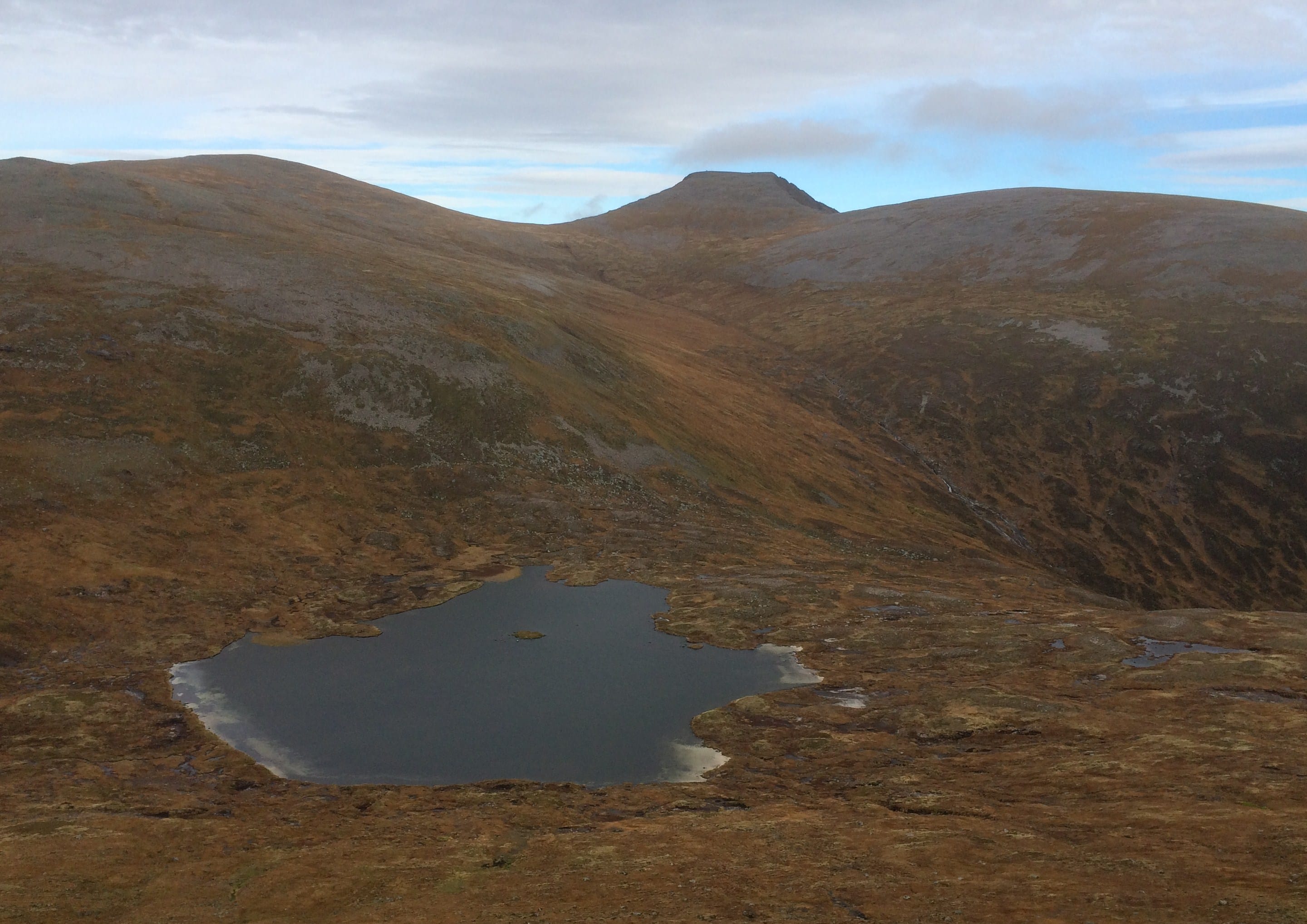 EMPTY HEART: Descending to lonely Loch Stuirteag from Monadh Mor with Cairn Toul standing high above on the horizon