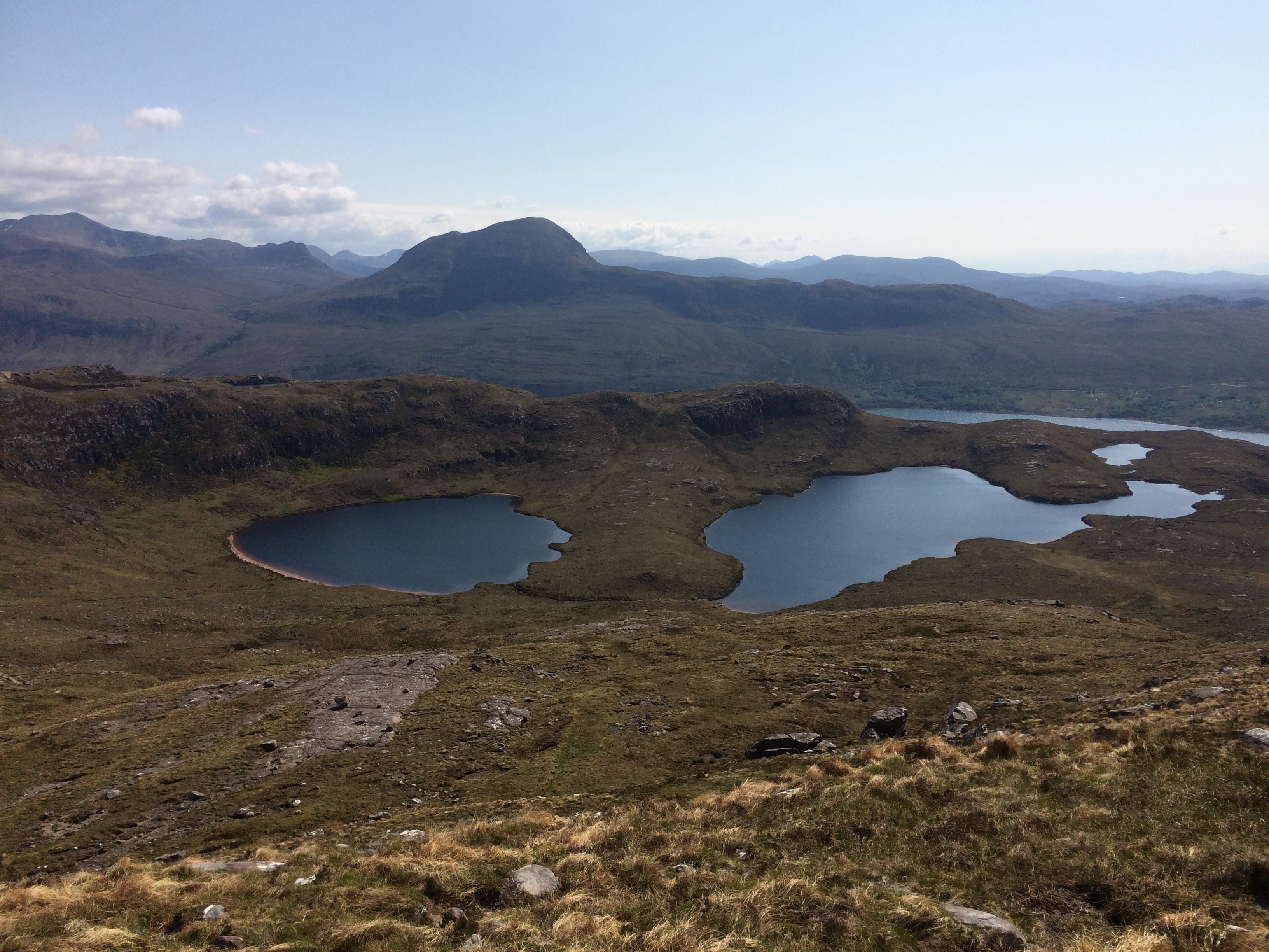THE HILLS HAVE EYES: The twin lochans of Beinn Ghobhlach from the route to the summit, with the Dundonnell hills in the background
