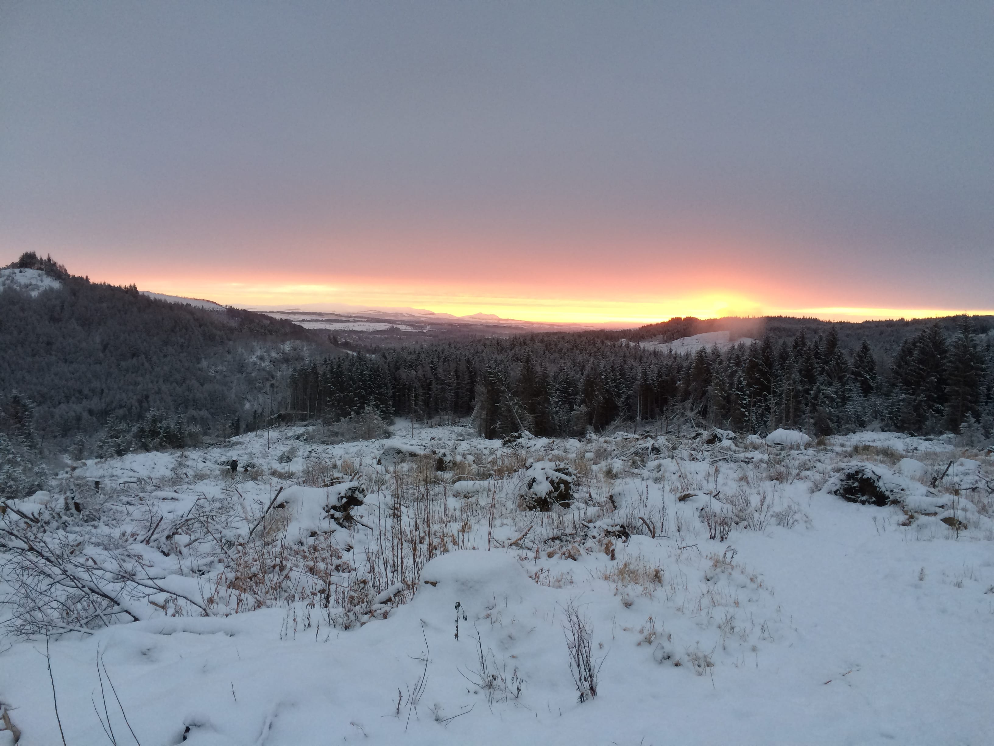 PAY AS YOU GLOW: Sunrise in the Trossachs, one of the battlegrounds over strict car parking proposals by the national park authority