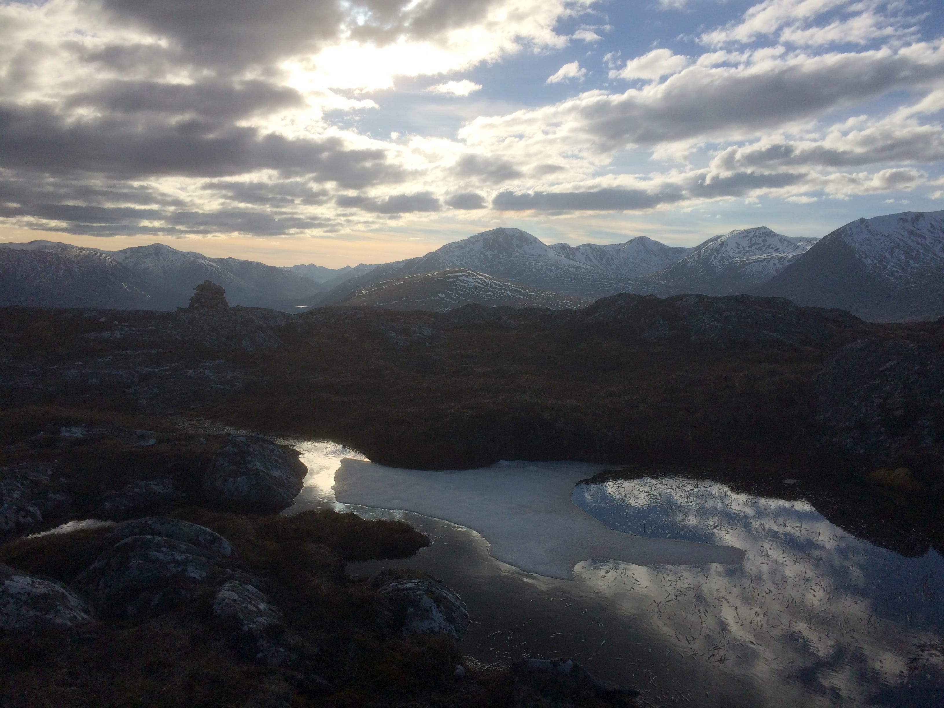 CALM ABOVE THE STORM: Evening light plays on the Affric peaks in this shot from the Beinn a' Mheadhoin, high above the carnage