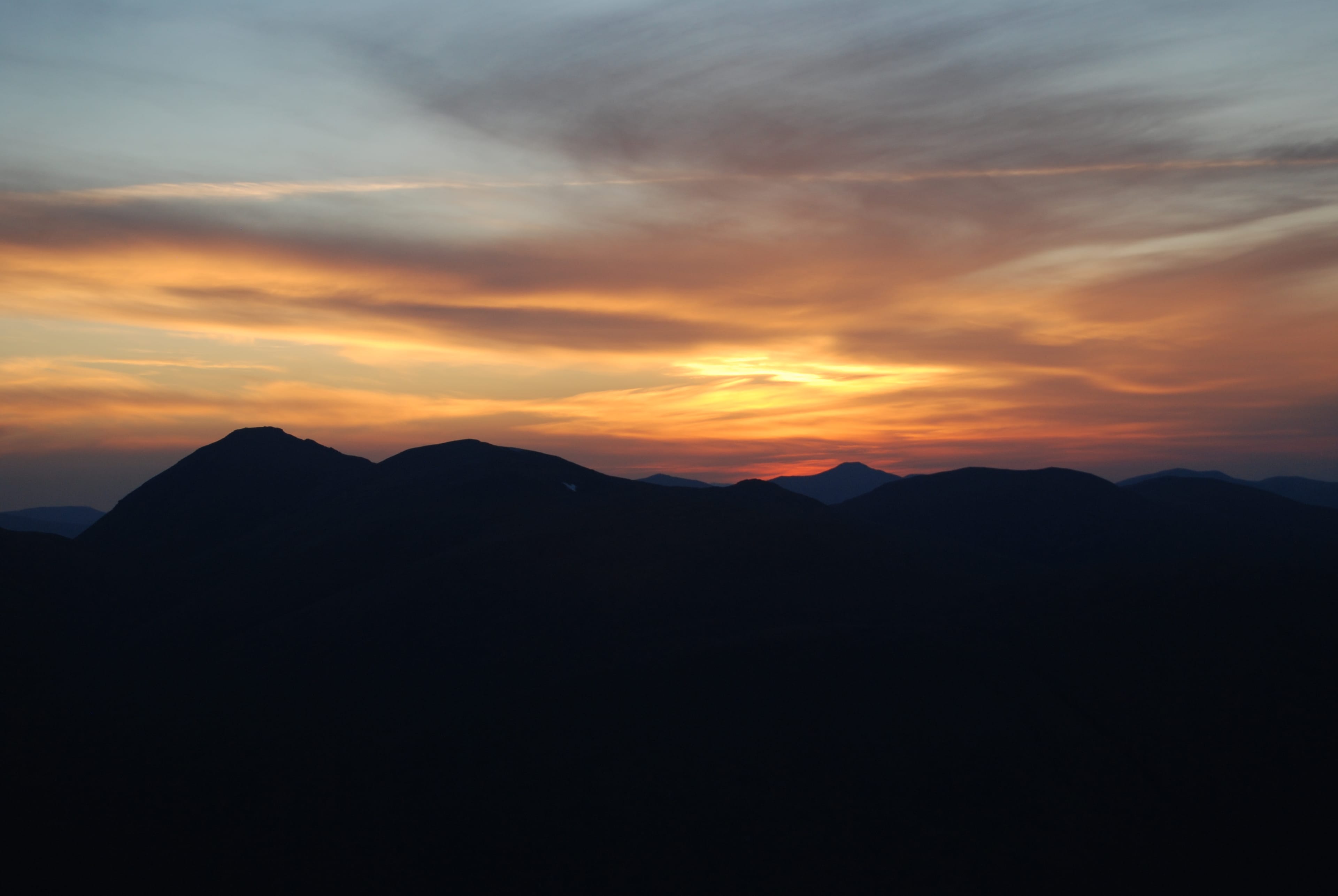 BLAZING SKY: Watching the rising dawn from the summit of Being Fhionnlaidh after a long night walk