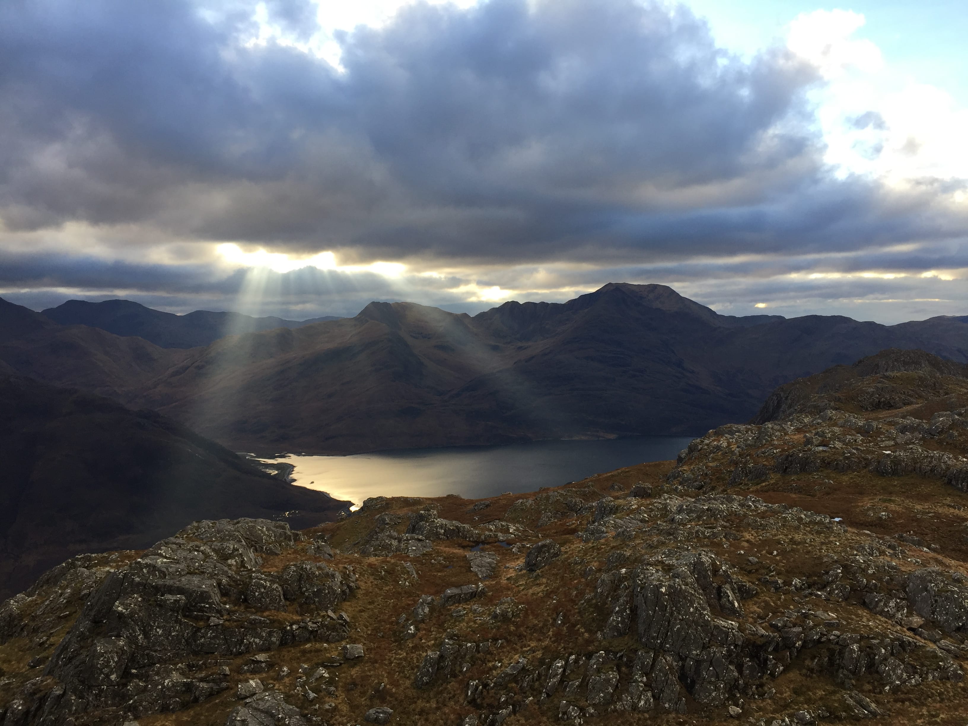 LIGHT FANTASTIC: Shafts of sunlight laser down over Ladhar Bheinn and the waters of Loch Hourn from Druim Fada ridge