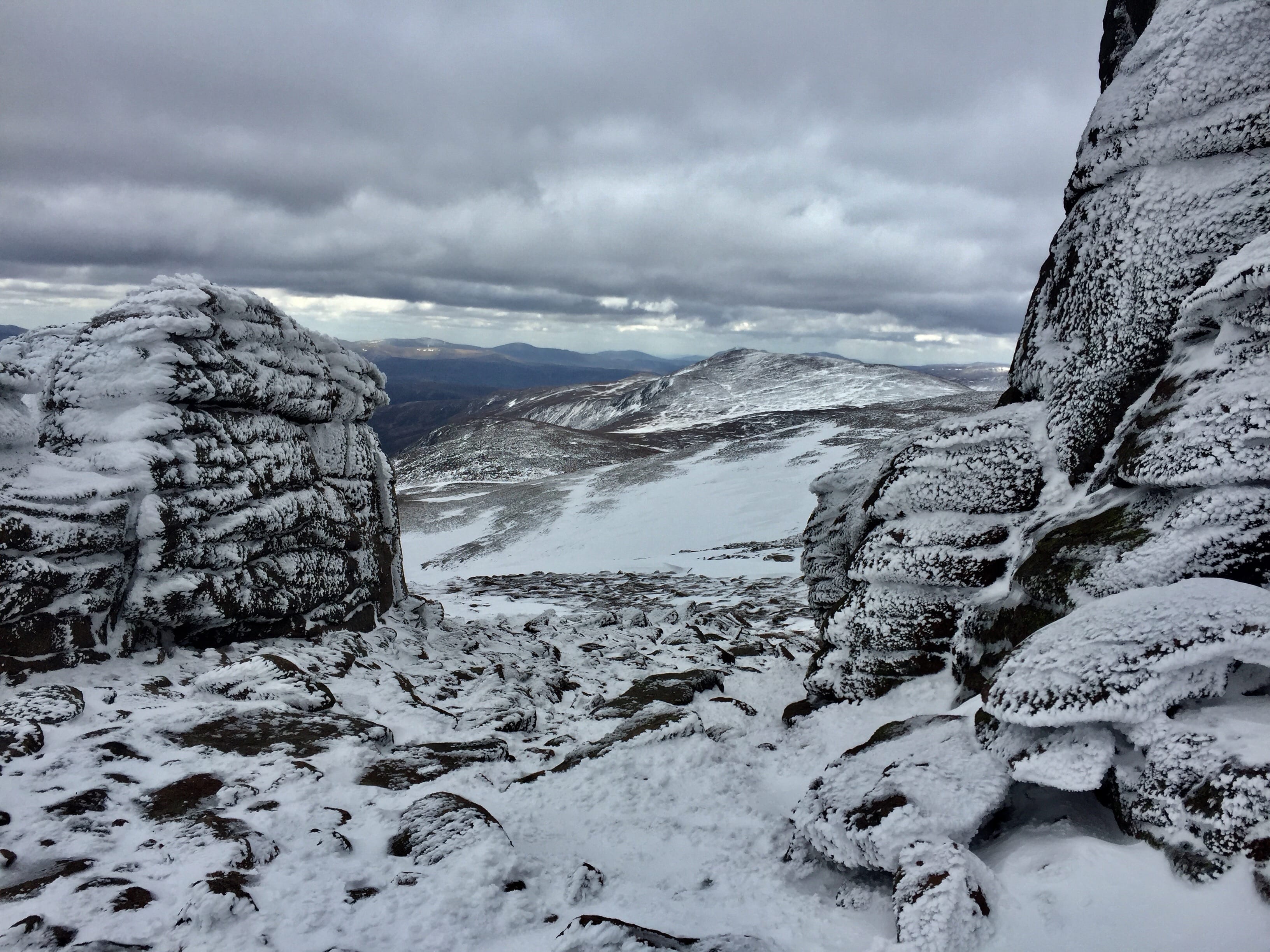 FROZEN KINGDOM: Looking over to Derry Cairngorm from the summit rock tors on Beinn Mheadhoin