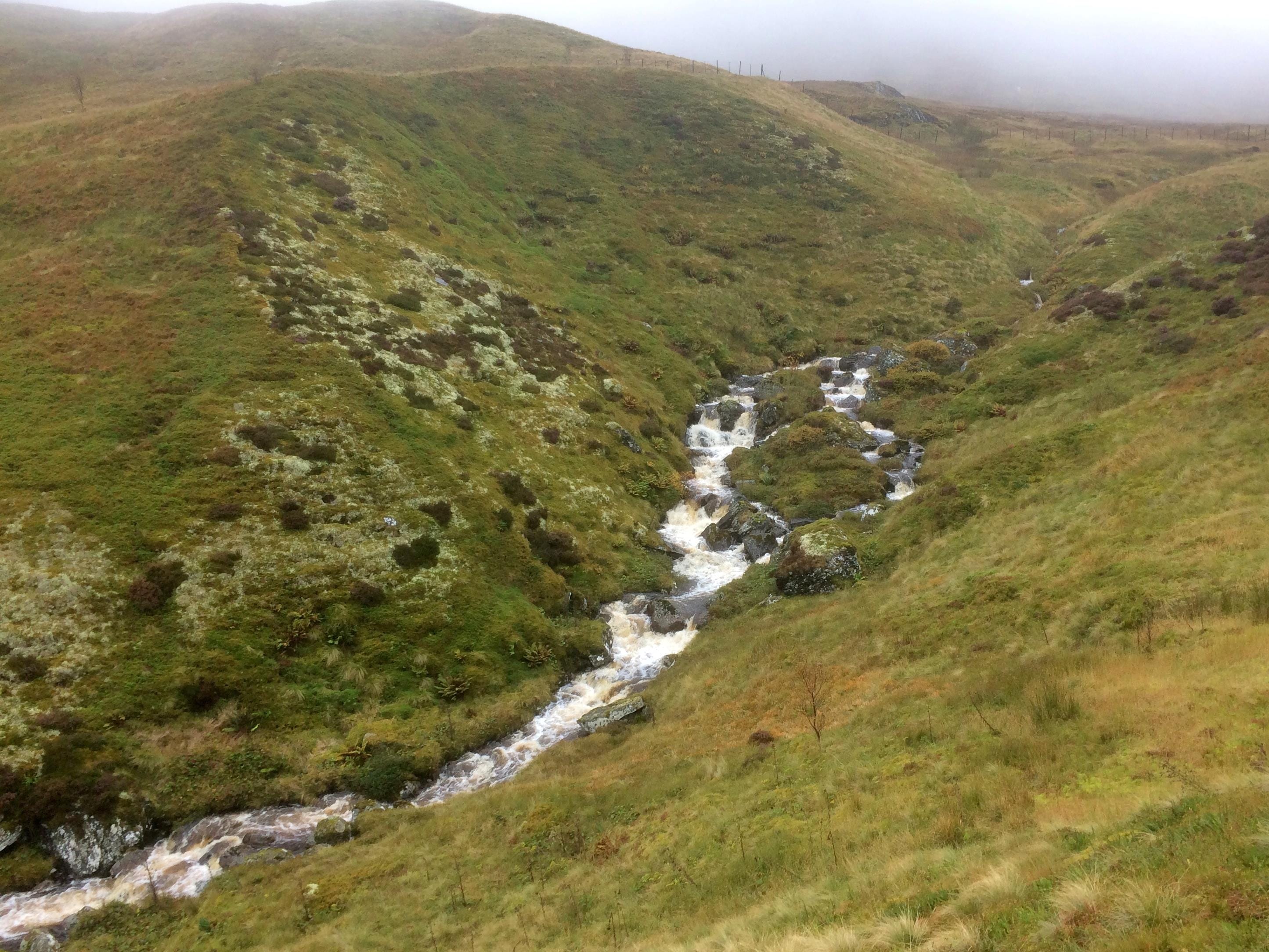 WET AND WILD: White water rushes down Coire Odhair during torrential rain on a day's walk in the Ben Lawers range
