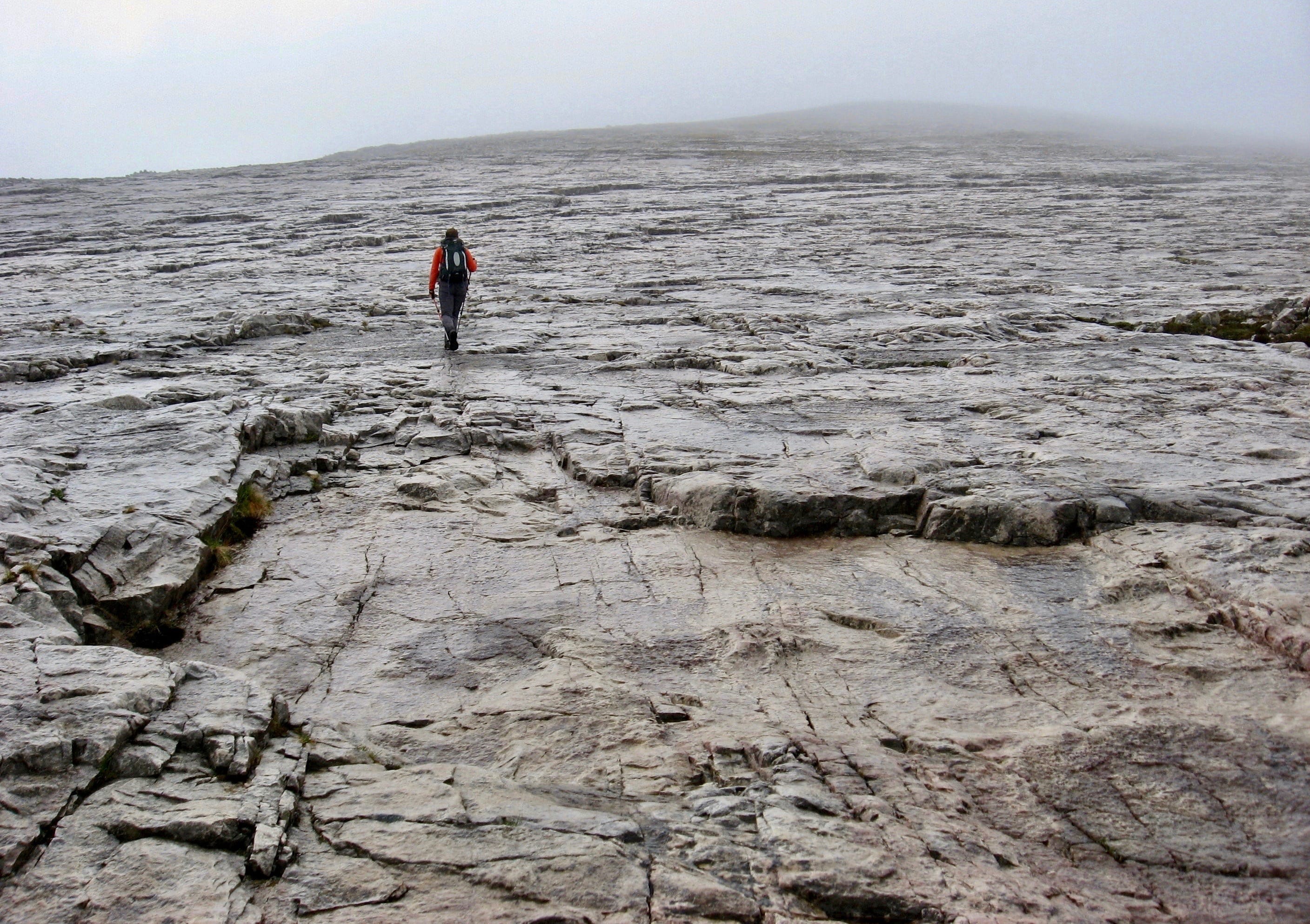 MOONSCAPE ASCENT: Heading up the wide swathe of quartzite slabs to the summit of Sgurr Ban on a grey, misty day