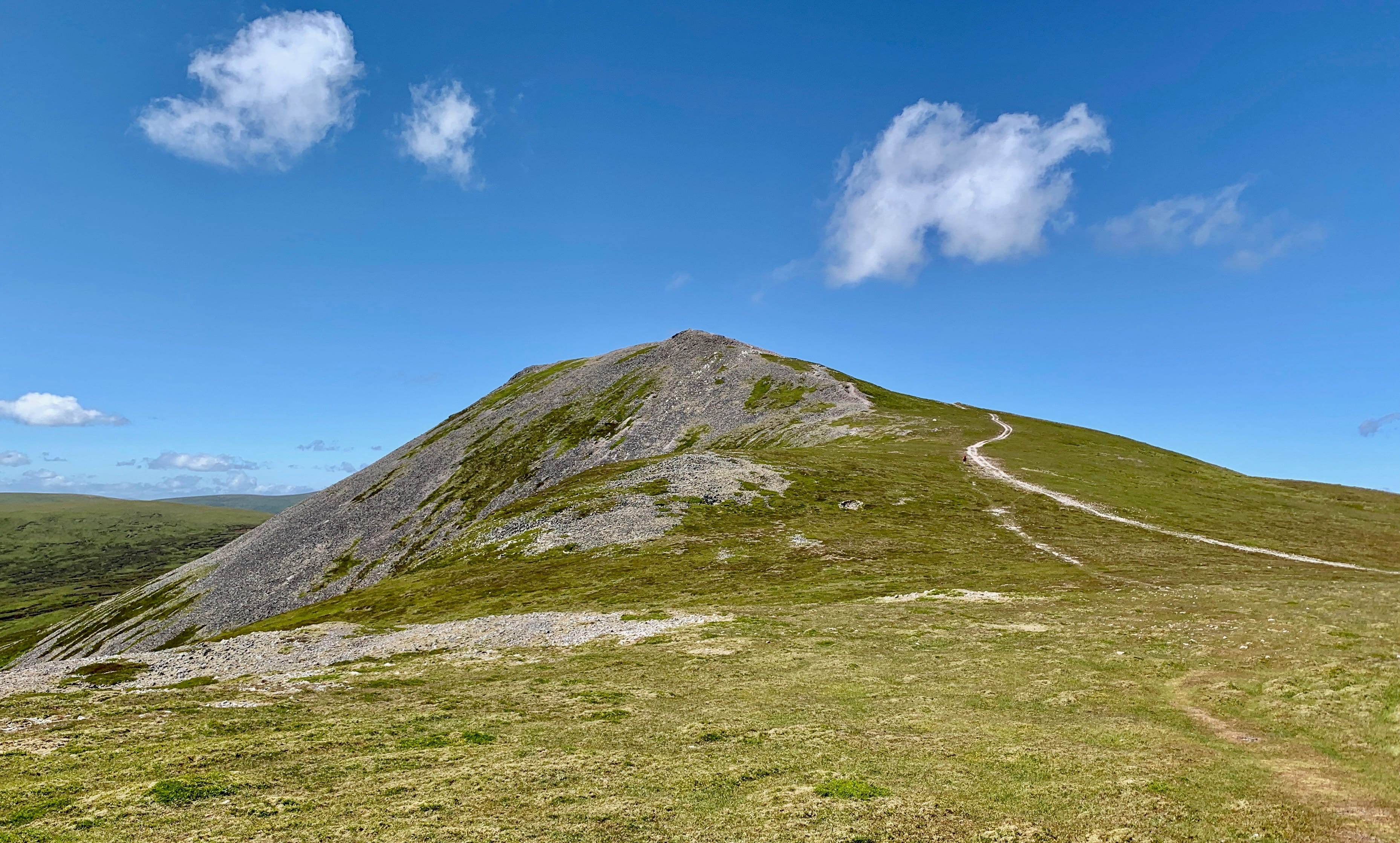 HEATWAVE SUMMIT: Blue skies and shining white rocks on Carn a' Chlamain from the track on the long descent