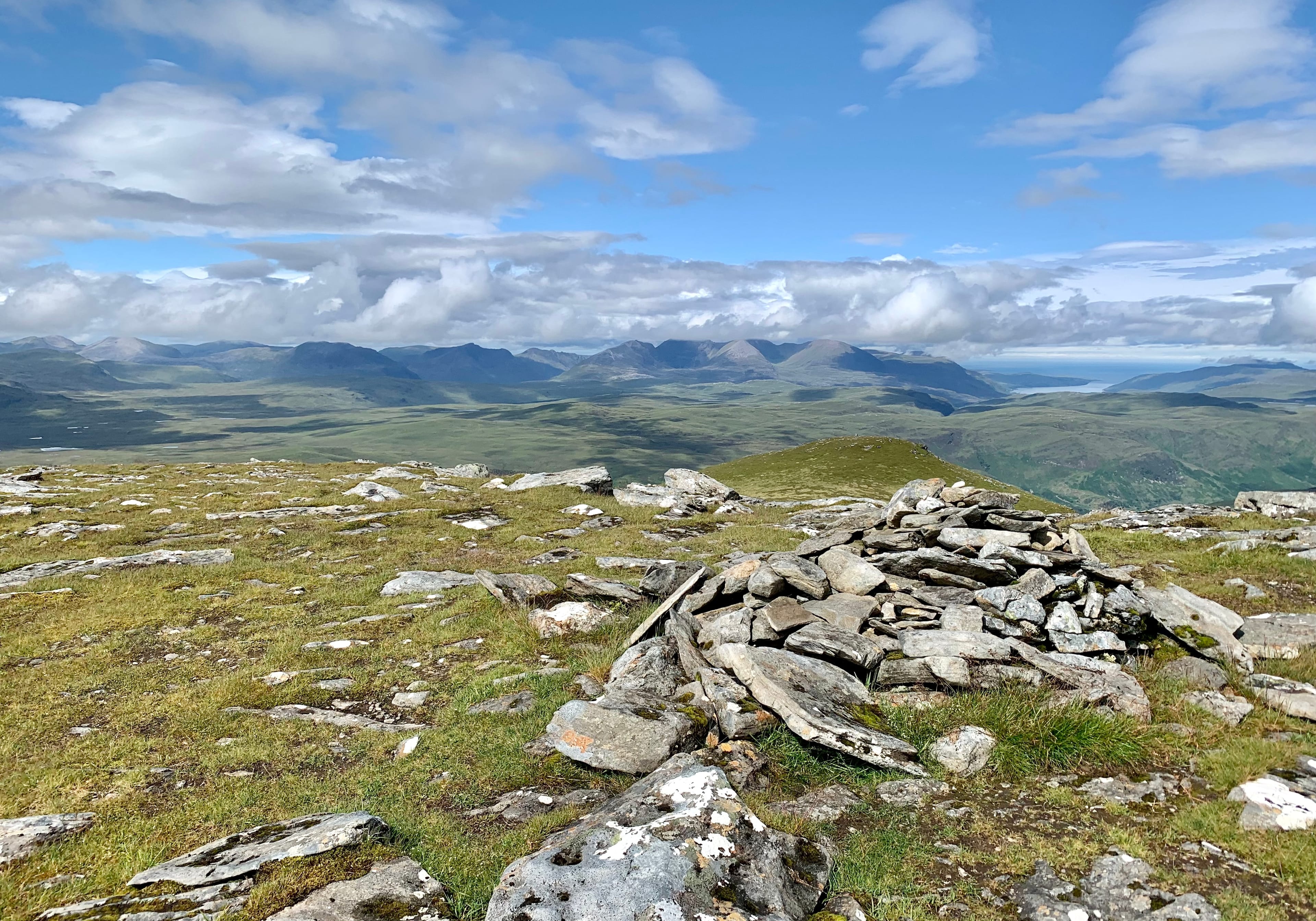BLUE-SKY INTERVAL: Looking over to the Fisherfield peaks from the summit of Beinn Enaiglair before the storms rolled in
