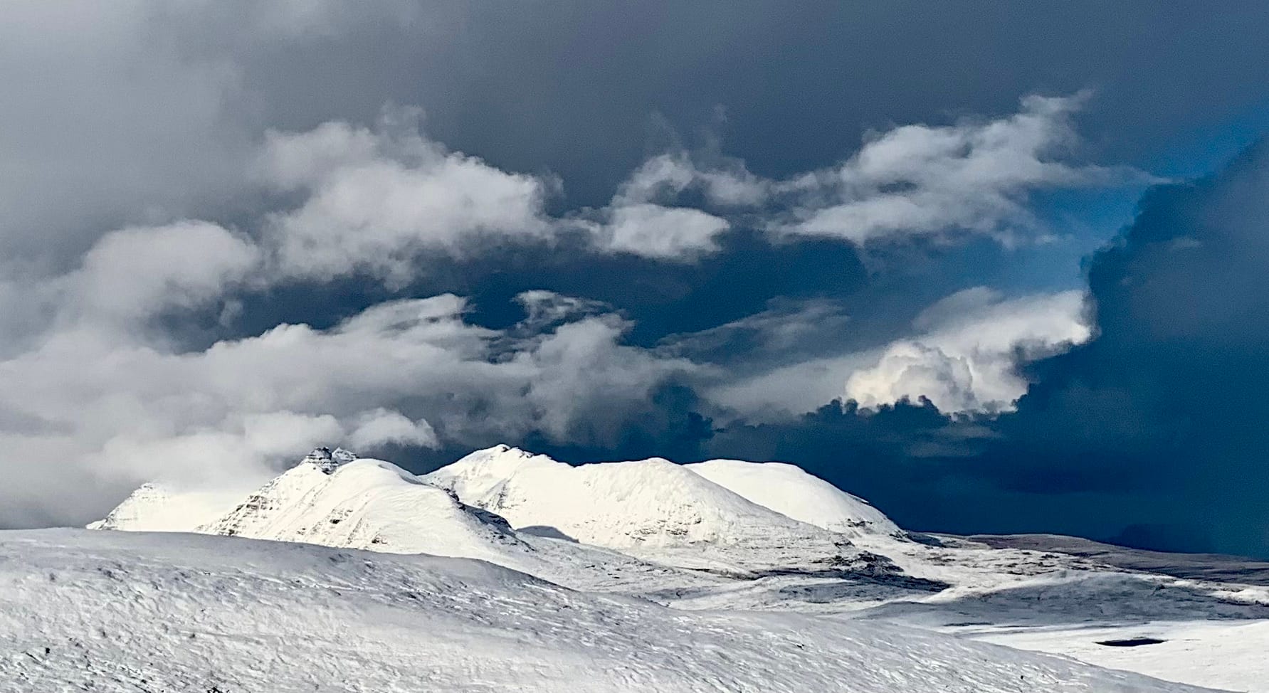 BLACK n' WHITE: Threatening skies and towering clouds growing darker by the minute over the brilliant white spires of An Teallach
